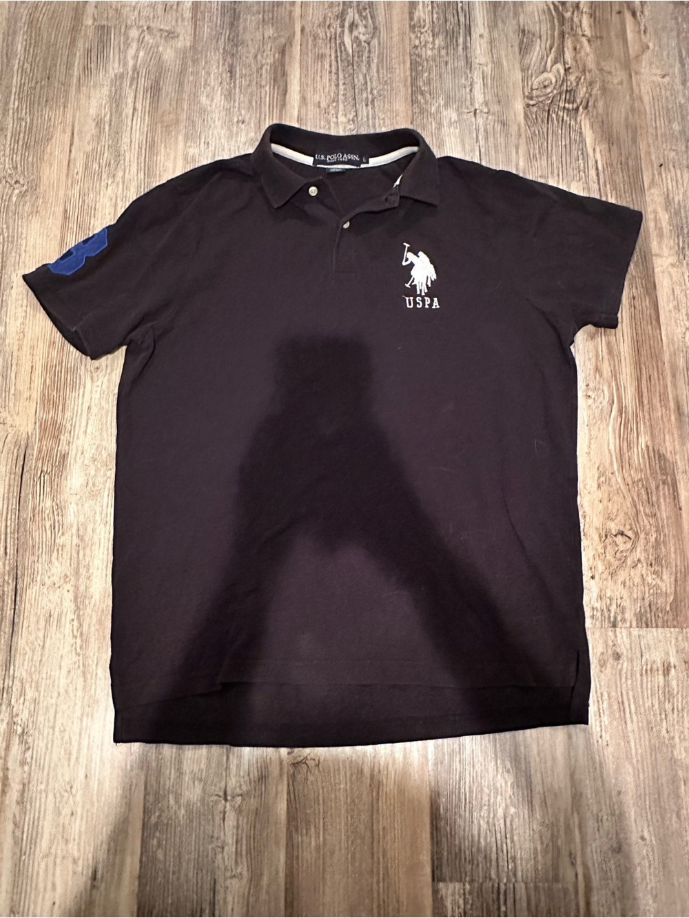 U.S. Polo Assn. Men’s Black Polo with White Logo and Blue Sleeve Patch